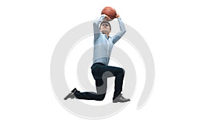 Man in office clothes playing basketball on white background. Unusual look for businessman in motion, action. Sport