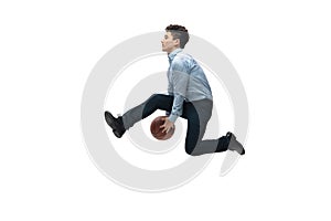 Man in office clothes playing basketball on white background. Unusual look for businessman in motion, action. Sport