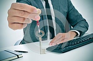 Man in an office giving a key