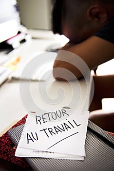 Man at office and text back to work in french photo