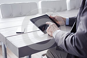 Man in the office using tablet pc