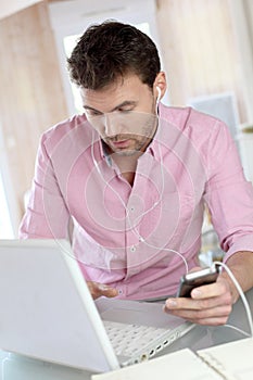 Man office worker on laptop at home