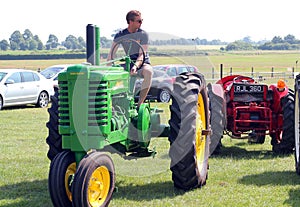 Man on an old tractor.