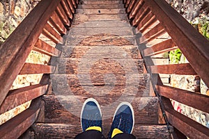 Man on old wooden stairs