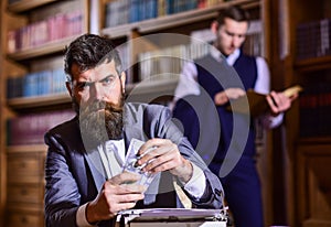 Man in oldfashioned suit holds money. Journalist got reward