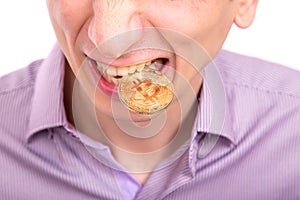 Man with one gold bitcoin coin on a tooth