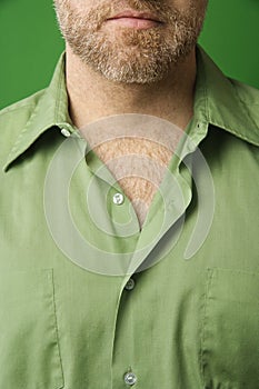 Man with open collar shirt.