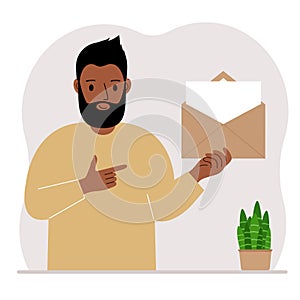 A man with an open envelope with a letter. Empty sheet of paper for text template. Mail concept. Sending a message