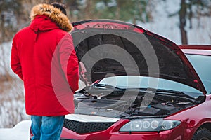 man opened car hood breakdown at highway road