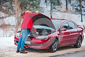 man opened car hood breakdown at highway road