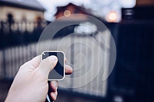 Man opening automatic property gate