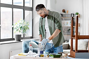 man opening can with grey color at home