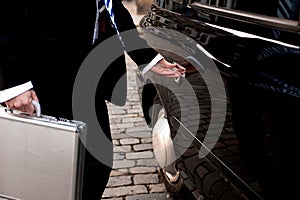 Man opening door of taxi cab