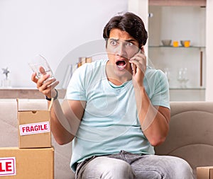 Man opening fragile parcel ordered from internet