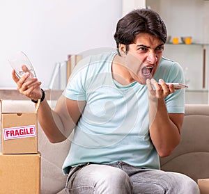 Man opening fragile parcel ordered from internet