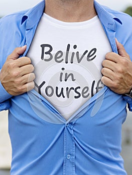 Man opening his shirt with quote Belive in yourself
