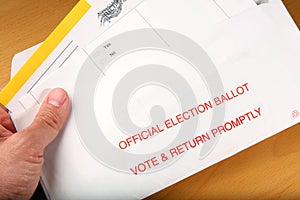 Man opening mail in ballot photo