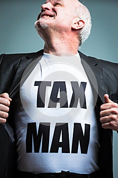 Man opening shirt with tax man text