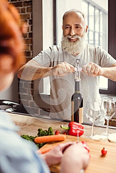 Man openning wine photo