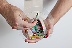 A man opens a box of firecrackers