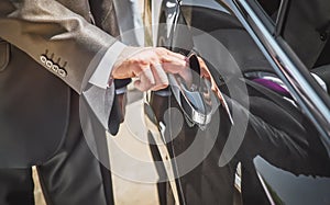 Man opens a car door