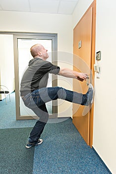 Man opens the door force photo