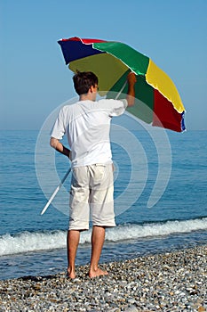 Man opens umbrella