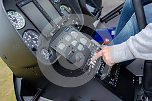 Man operating controls in cockpit