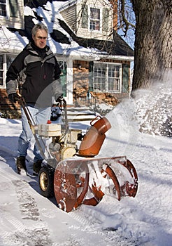 Man Operating Snow Blower