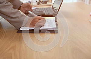 man organize plan with notebook & smart phone. businessman working at workplace