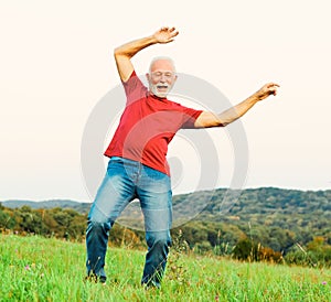 man outdoor senior happy lifestyle retirement dancing nature mature active elderly vitaliti training exercise stretching