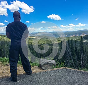 Man overlooking caldera at Yellowstone National Park