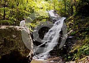 Man overlooks Overall Run waterfall