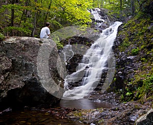 Man overlooks Overall Run waterfall