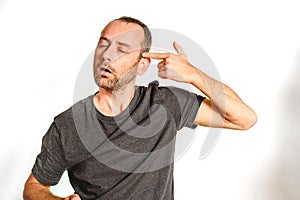 Man in overwhelmed studio pointing with hand to head, model expressions isolating white background