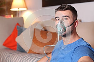 Man with oxygen mask at home