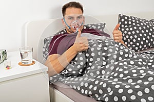 Man with oxygen mask at home