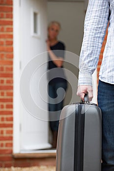 Man With Packed Suitcase Leaving Wife