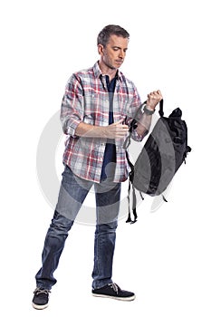 Man Packing Bag and Preparing to Travel or Hike