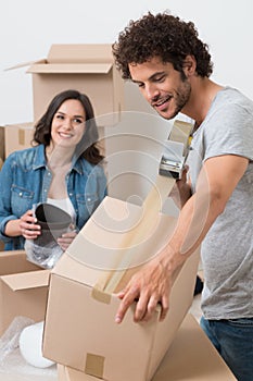 Man Packing Box With Sellotape