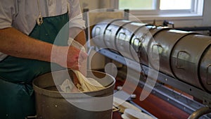 Man packing cheese ready for processing