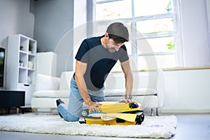 Man Packing Stuffed Suitcase Bag