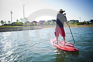 Man on a paddle board on lake