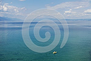 Man in a paddle boat on lake ohrid