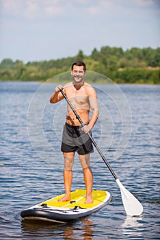 Man on paddleboard. photo