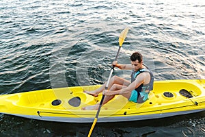 Man paddling a kayak