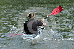 Man Paddling a Kayak