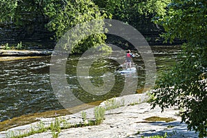 Man padeling on Jacques-Cartier river in Pont-Rouge Quebec