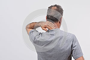 Man with pain on nape on white background