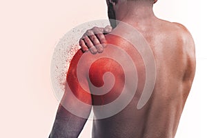 Man with pain in shoulder